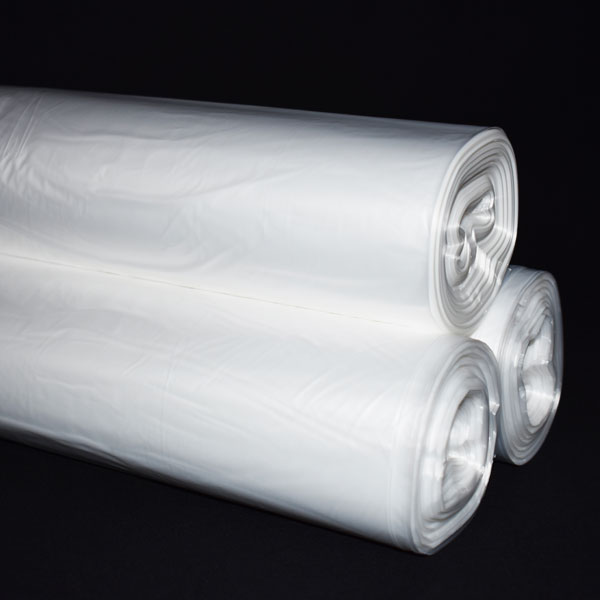 3 rolls of white plastic bags.